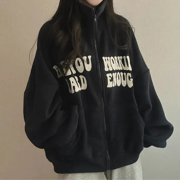 Black oversized zip-up hoodie with a front graphic print